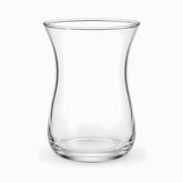 Single empty clear glass Turkish tea glass showing the curved tulip shape