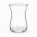 Single empty clear glass Turkish tea glass showing the curved tulip shape