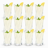 12 twisted diamond-cut glass tumblers in 3 rows filled with lemonade, mint and lemon wedges