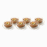 Set of 6 hammered glass dessert bowls and wavy saucers with gold edges filled with meghli