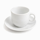 Single empty white porcelain coffee cup with stepped foot and loop handle on a round saucer