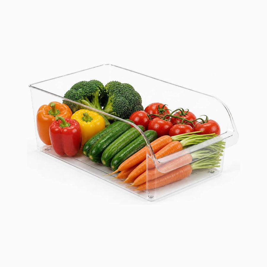 Wide clear plexi fridge organizer bin filled with broccoli, peppers, tomatoes, cucumbers and carrots