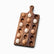 Acacia wood egg board with handle and 18 holes, partly filled with brown and cream eggs